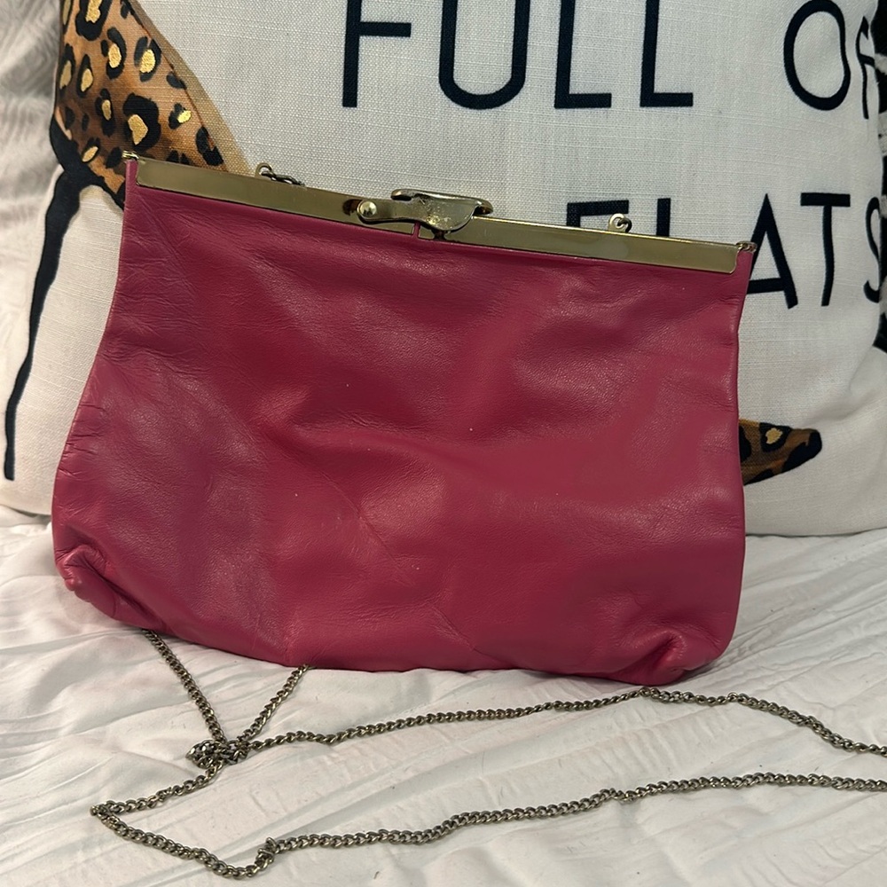 Small clutch with gold strap and gold enclosure